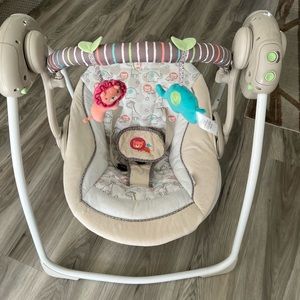 Ingenuity foldable compact multi-speed swing with timer and music.